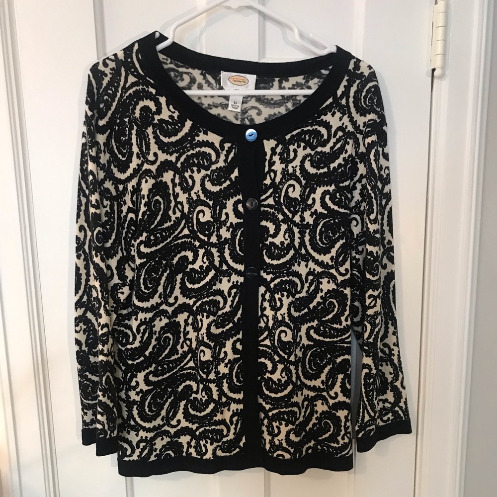Black and white patterned cardigan.
